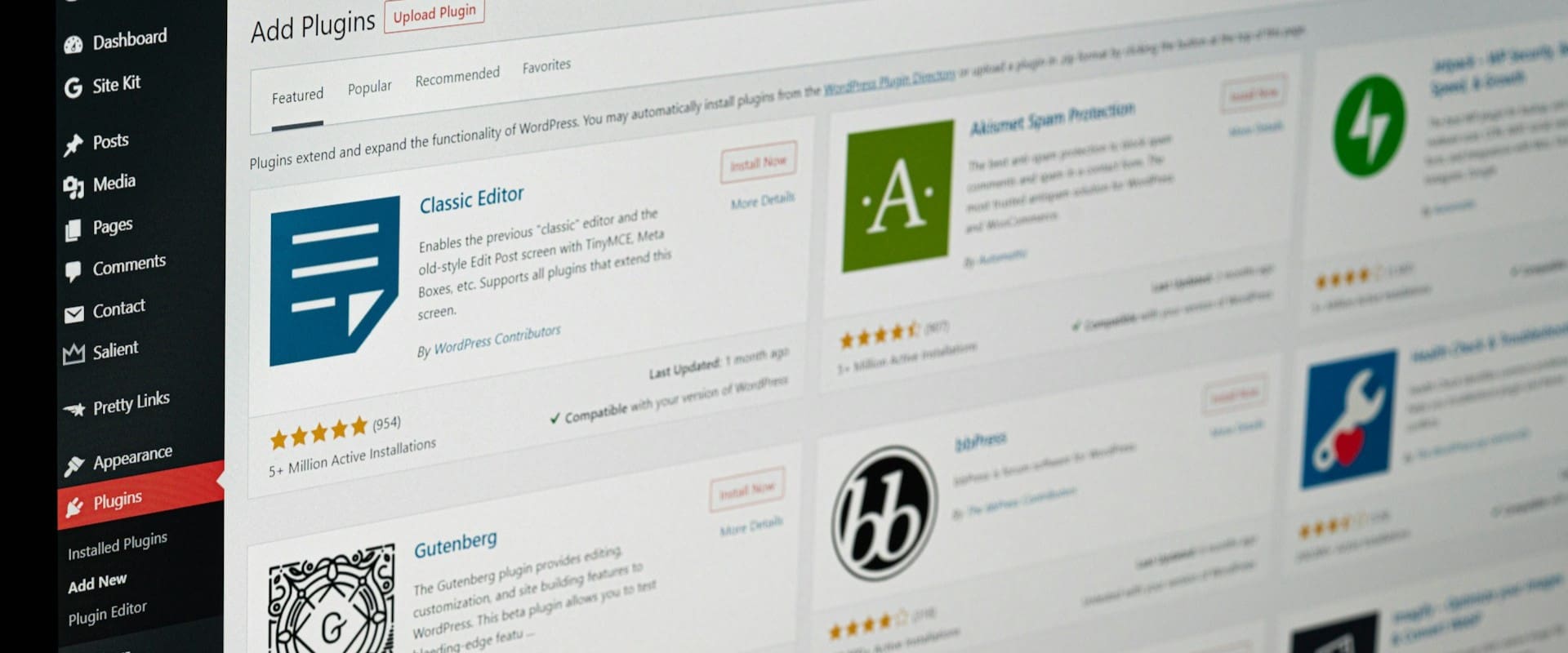 Various WordPress plugins on a laptop screen