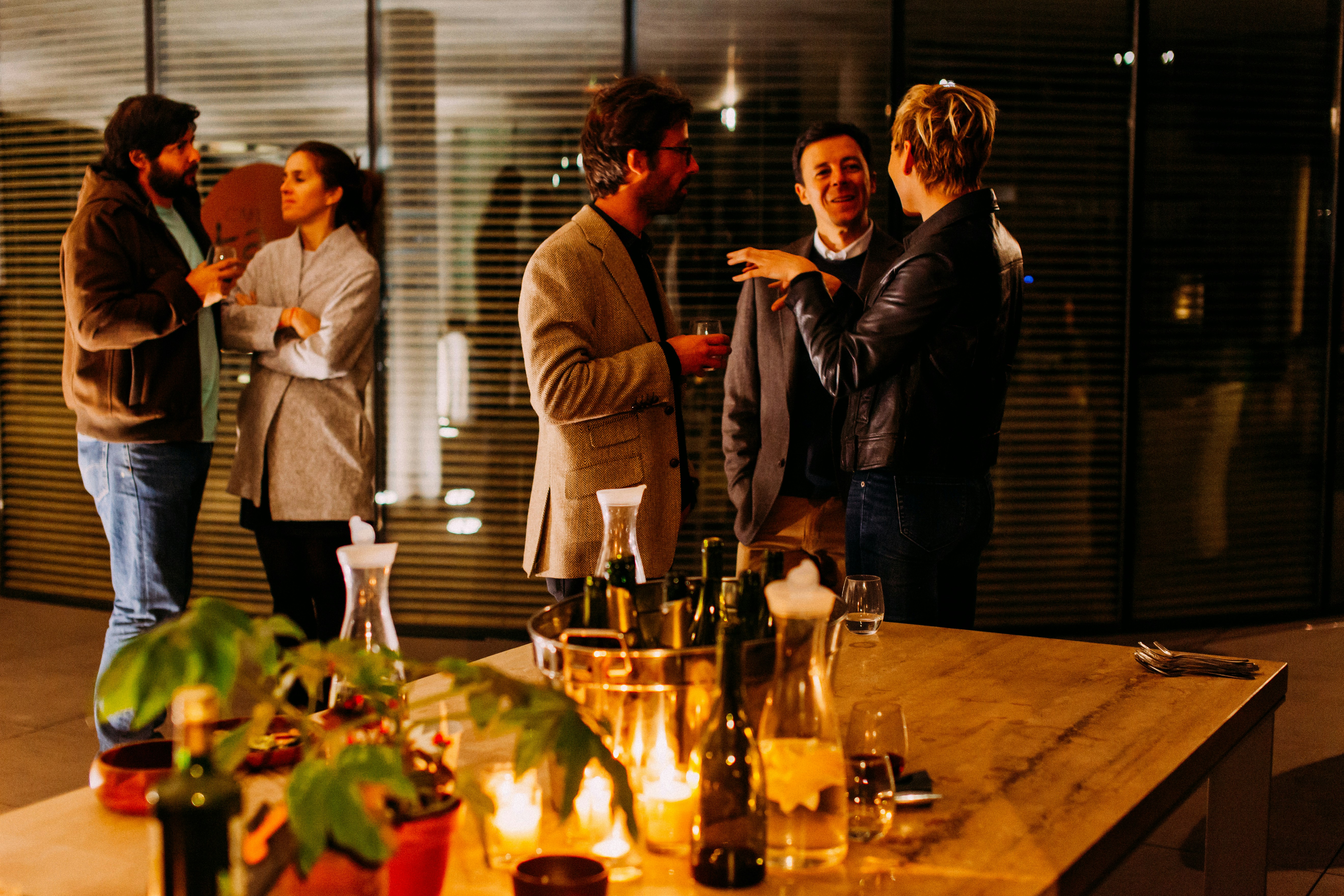 A small group at an evening networking event in Surrey