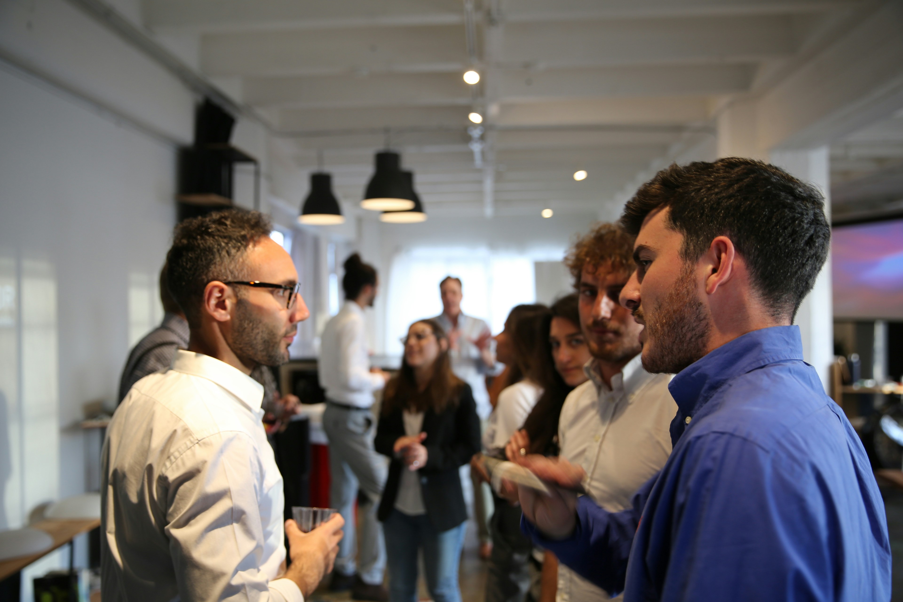 Some people chatting at business network event